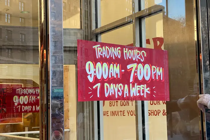 A photo of new store hours posted at a Trader Joe's in the Upper West Side.